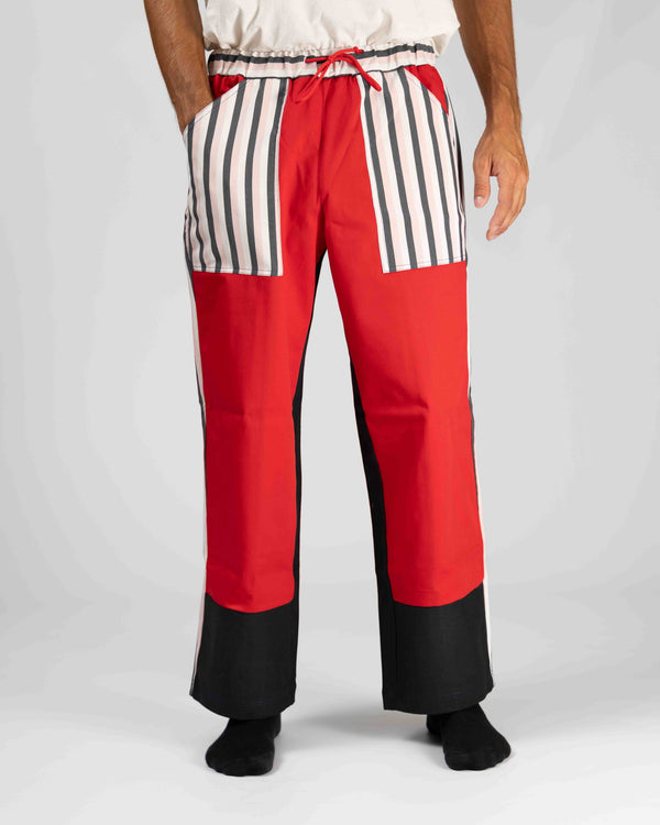 Pantaloni L'ALTROMONDO Limited Edition rossi e neri con tasche a righe bianche e nere, vista frontale
