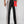 Pantaloni L'ALTROMONDO Limited Edition vista da dietro, gambe a righe bianche e nere e tasca rossa