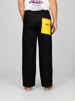 Pantaloni CEREDO Limited Edition vista da dietro, tasca posteriore gialla con logo Braghe